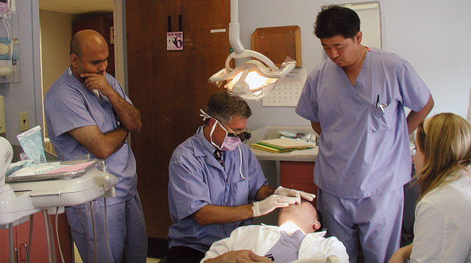 Dr. Falciano performing a dental procedure